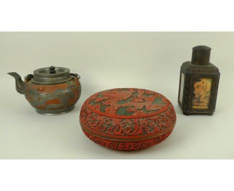 A Chinese pottery and silver metal mounted teapot, early 20th century, with two brass handles, decorated with two dragons cha