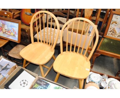 A pair of Ercol style stick back kitchen chairs