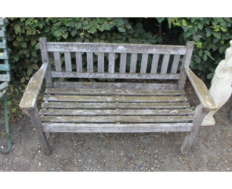 A hardwood two seater garden bench