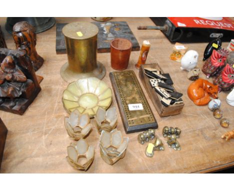 A brass shell case door stop, a brass mounted cribbage board, a quantity of bone and ebony dominoes etc.