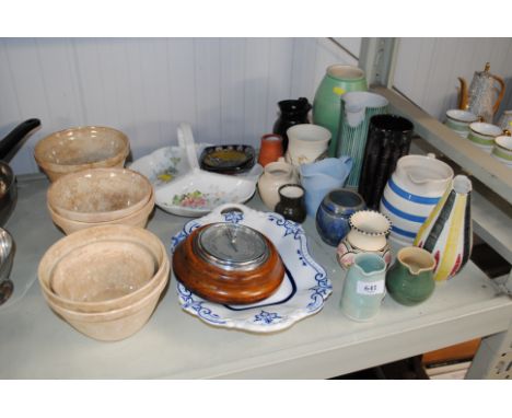 A collection of various assorted pottery to include jugs, vases, vintage pudding bowls, small barometer etc.