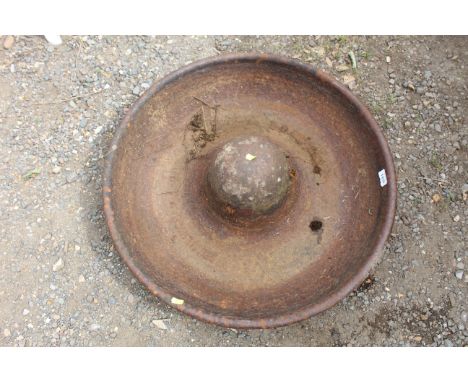 A circular Mexican Hat style cast iron pig trough marked Framlingham