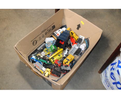 A box of various play worn die cast and other model vehicles
