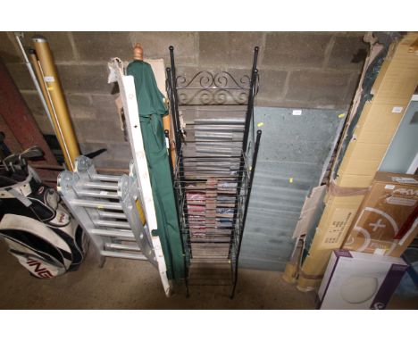 A wrought metal four tier garden shelf