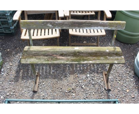 An unusual two seater bench with cast iron supports and folding seat