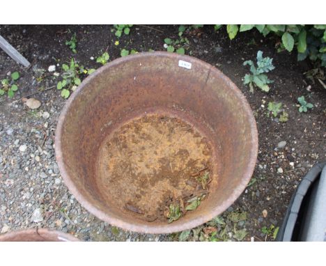 A large circular cast iron planter, approx. 20&frac12;" dia.