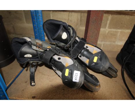 A pair of four in line roller skates