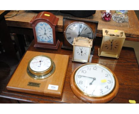 A quantity of various clocks and a Guinness weather barometer