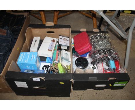 A box containing various items to include computer wireless mouse, 12v heater fan, digital alarm clock, baby ear muffs, vario