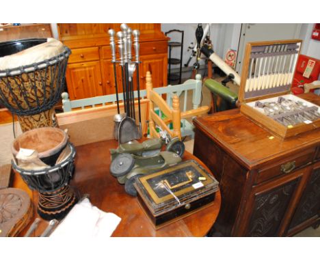 A Milners' cash tin, a plastic model of a WWII motorcycle and sidecar; a companion stand
