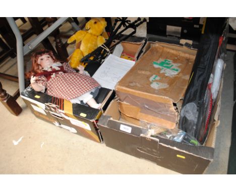Two boxes of miscellaneous toys to include a doll, teddy bear, model vehicles etc.