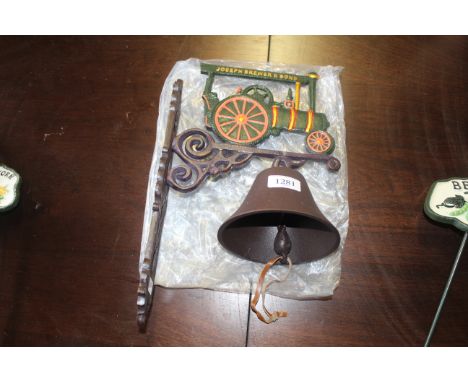A wall mounting cast iron door bell in the form of a steam engine (72)