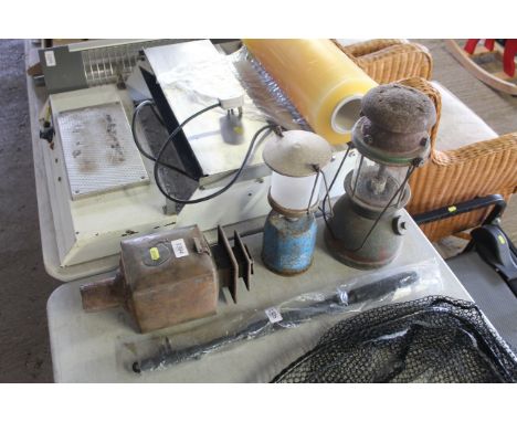 A Tilley style lamp with swing handle, a metal road lamp and a Camping Gaz lantern