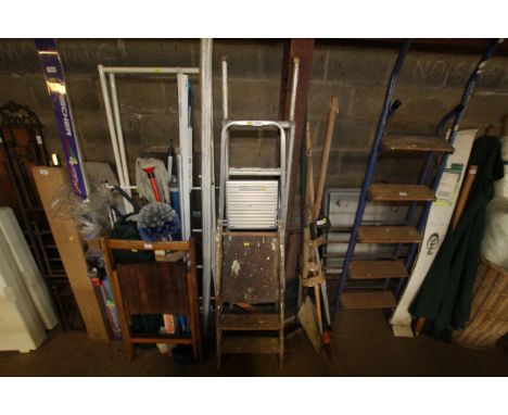 An aluminium folding ladder, a set of Beldray aluminium steps and a set of wooden steps