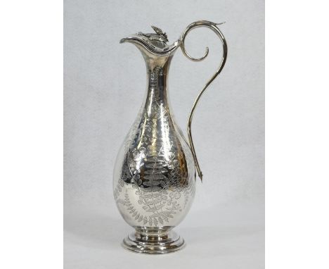 SILVER WINE FLAGON - on a circular step base, narrow neck, hinged lid, scrolled handle and all over leaf decoration, no inscr