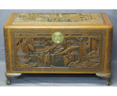 CHINESE CAMPHORWOOD LIDDED CHEST - deep carved pagodas and people in garden settings, original brass lock and interior lift-o