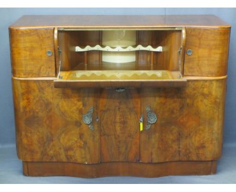 ART DECO STYLE WALNUT COCKTAIL SIDEBOARD with shaped drop-down front fall and decorative interior shelf, shaped door outer cu