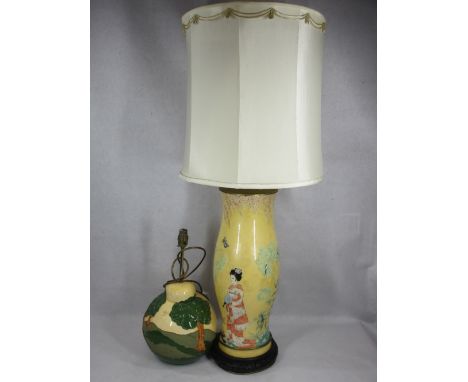 JAPANESE REVERSE DECORATED GLASS LAMP - on carved wooden base with shade and a globular pottery table lamp with stylised tree