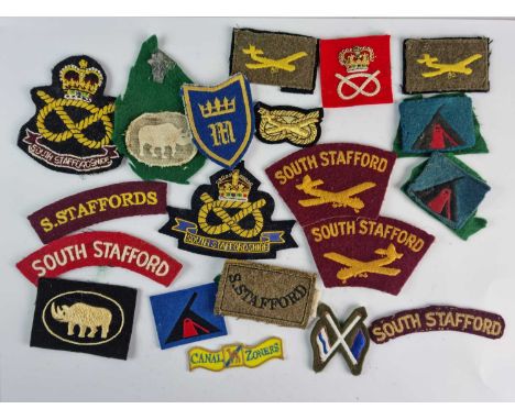 A quantity of British Army South Staffordshire Regiment military shoulder flashes and other cloth formation badges etc