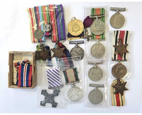 A mixed group of medals comprising five Second World War Defence Medals, Atlantic Star, 1939-45 Star, Africa Star, Italy Star
