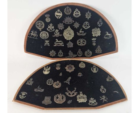 A substantial accumulation of British and foreign cap badges and buttons, RAF cloth badges and insignia, two semi-circular bo