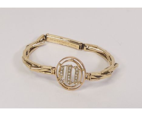 9ct gold hallmarked unusual seed pearl set bangle, weight 9.07g.