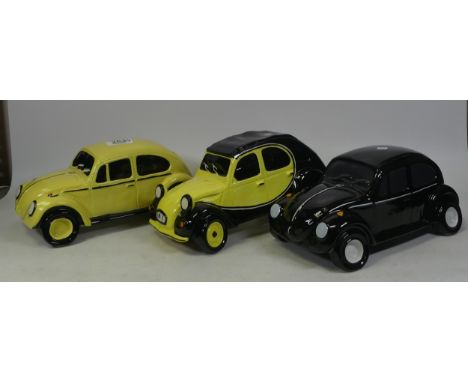 Three large ceramic cars to include two VW Beetle's and Citroen 2CV moneybox. (L: 24cm x H: 13cm)
