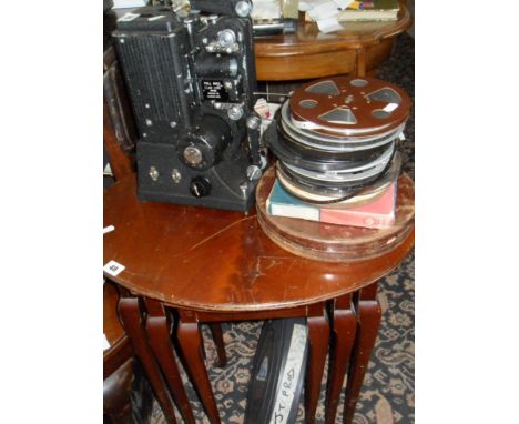 Old Specto film projector with case, assorted films and a 35mm film in a can