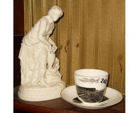 Victorian souvenir cup and saucer with black and white transfer of West Bay, Bridport scenes and a bisque figurine