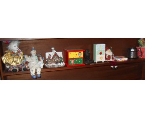 Shelf of Christmas figures and other items