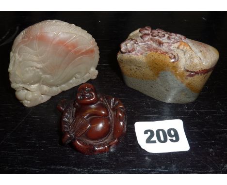 Chinese carved boulder seal, a hardstone carved sea dragon with pearl and a Chinese buddha netsuke (signed)