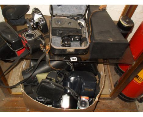 Large collection of cameras, bodies and lenses etc. inc. Minolta, Praktica, Petri, Nikon etc.