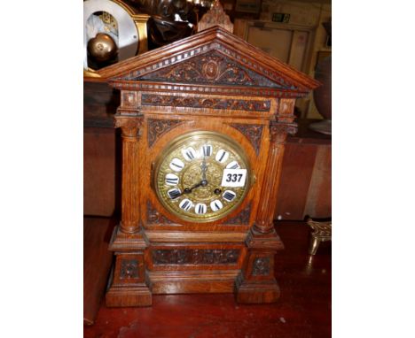Victorian carved oak mantle clock with brass dial & enamel numerals