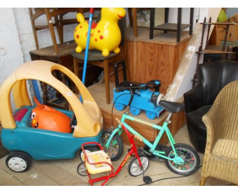 Various ride-on toys, a space hopper, pogo-stick and a "Magic Theatre"