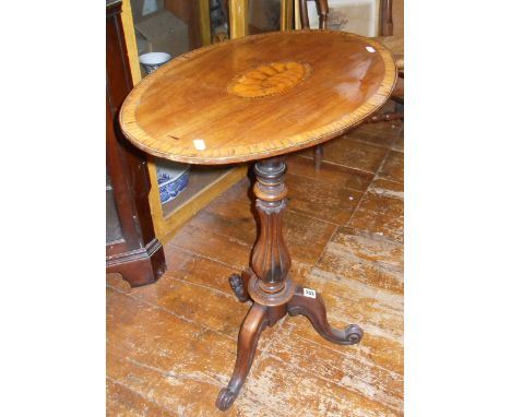 Mid 19th c. inlaid oval mahogany occasional table having shell inlay and cross banding on fluted column over tripod scrolled 