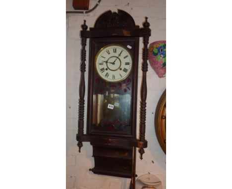 An early 20th c. long wall clock