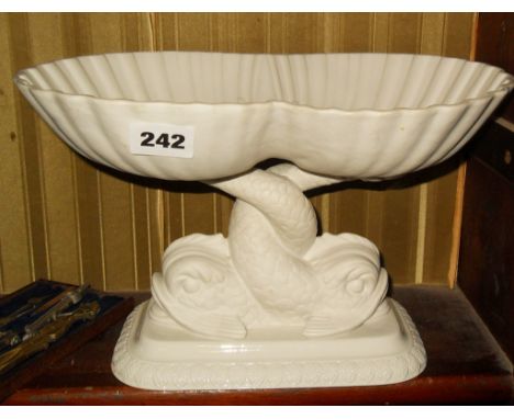 Bisque and white glazed tazza with entwined dolphins base