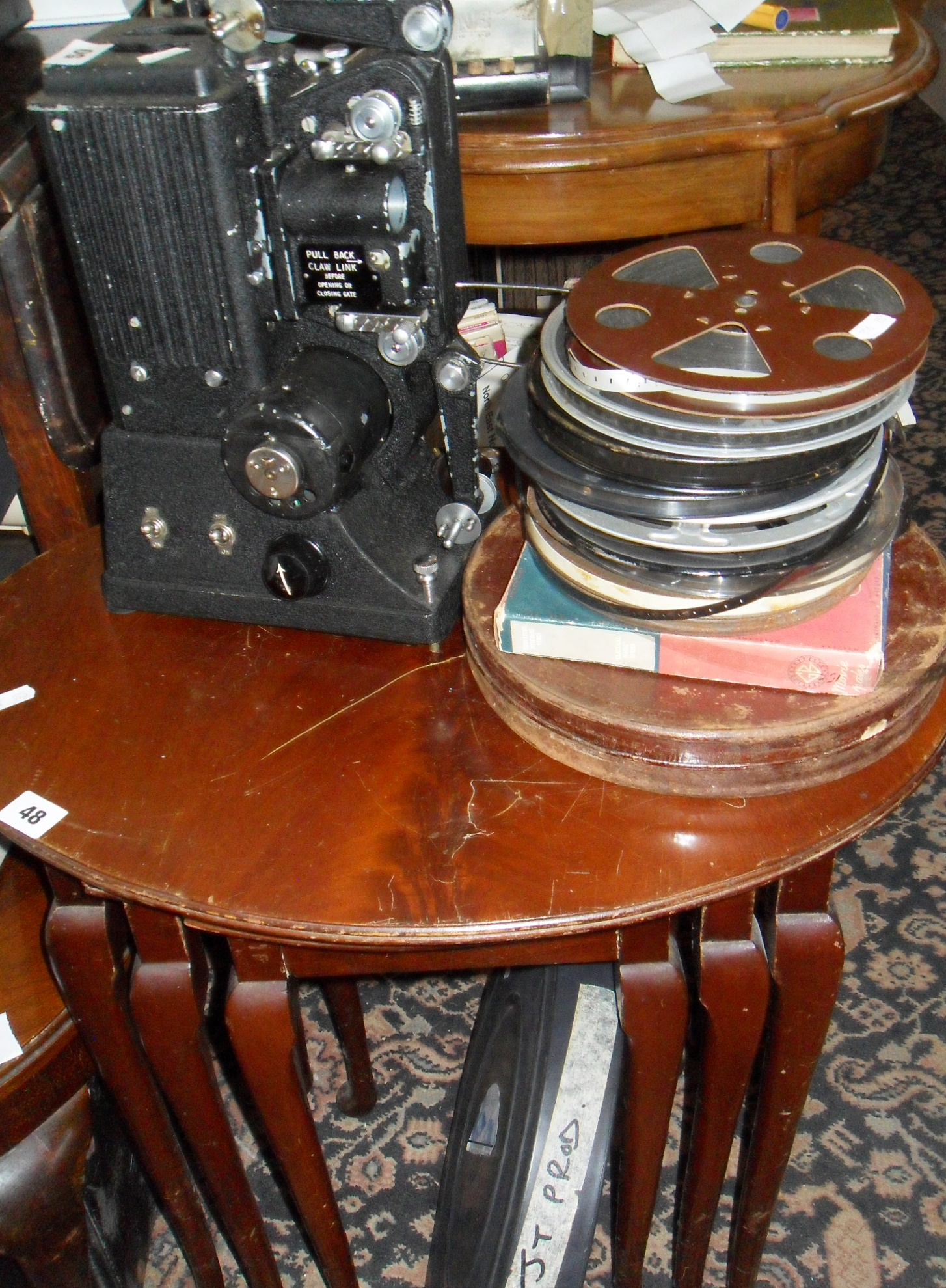 Old Specto film projector with case, assorted films and a 35mm film in