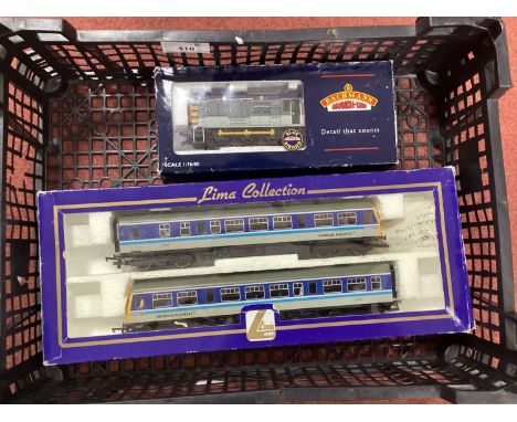A boxed Lima 00 gauge Class 101 two-car diesel multiple unit in Regional Railways livery and a boxed Bachmann Class 08 Diesel