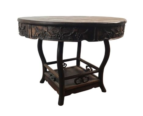 CHINESE PADOUK TABLE, 20TH CENTURY   the circular top above a floral and fruit decorated apron, the cabriole legs surrounding