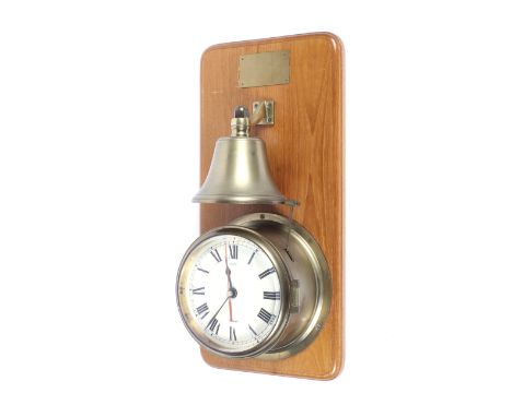 A Chime Nauticalia brass mounted clock and striking bell. Mounted on a wooden plaque, the clock with cream painted dial and b
