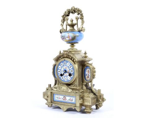 A gilt-metal and Sevres-style porcelain mounted mantel clock, circa 1900. Mounted with a gilt finial over a ceramic urn paint