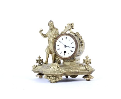 A gilt-metal mantel clock, circa 1900. Mounted with a man holding a hammer and chisel, the white dial with Roman numerals, wi