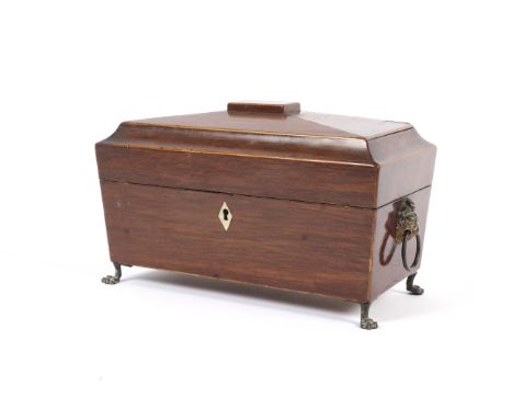 A Regency inlaid sarcophagus shaped tea caddy. With faceted domed cover inlaid with boxwood stringing, with lion mask ring ha