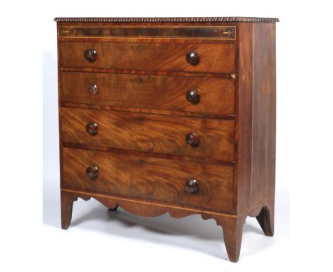 A 19th century inlaid mahogany chest of drawers. With gadrooned top above inlaid frieze and four graduated drawers, with turn