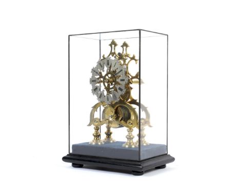 A 20th century eight-day brass skeleton clock on ebonised stand within a glass case. With a silvered, shaped chapter ring, wi