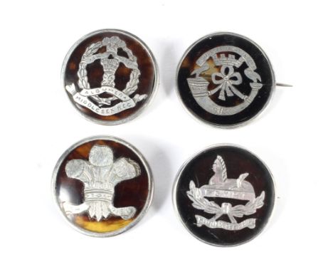 Four WWI silver and white metal mounted tortoiseshell sweetheart brooches. Including Gloucestershire Egypt, Somerset Light In