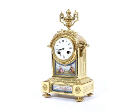 A gilt-metal and Sevres-style porcelain mounted mantel clock, circa 1900. Mounted with a finial, the white dial with Roman nu