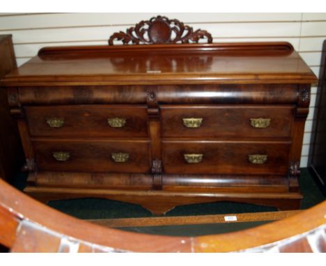 A 19th century mahogany chiffonier of six drawers, raised on bracket feet, with a carved upstand
