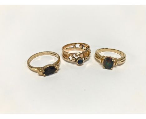 An opal set ring, stamped '585' and two 9ct gold dress rings, total weight 9.9g (3)